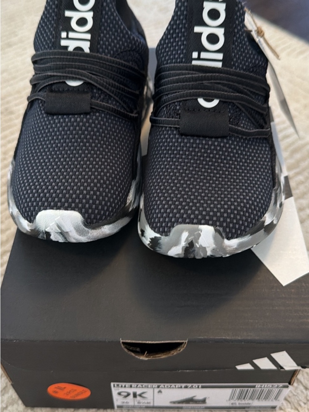 adidas Black Slip-On Sneakers with White and Grey Camo Sole